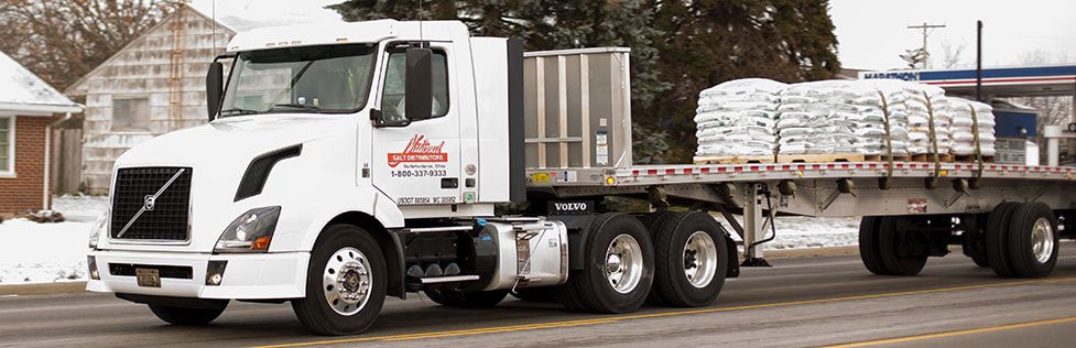 National Salt delivery truck with a truck-mounted forklift